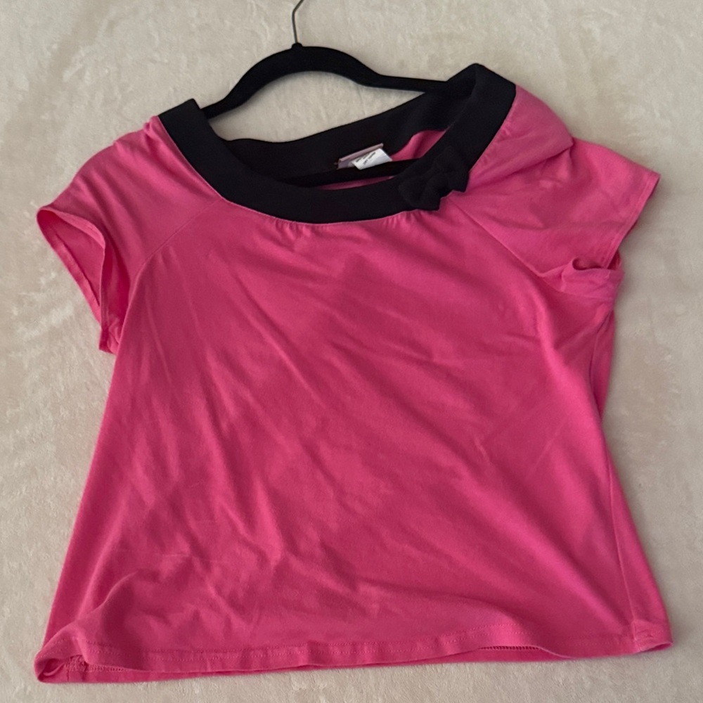 Women’s pink top with bow detail